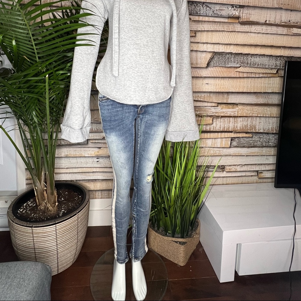 MNML distressed jeans with white stripes along the side